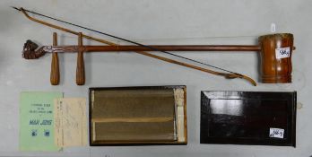 A Chinese Erhu Bow Instrument with Dragon Carved Head together witha Boxed Mah Jong Set. (2)