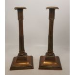 A Pair of 18th/19th Century Brass Candlesticks with Lead Filled Base. In the form of simplified