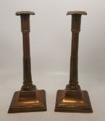 A Pair of 18th/19th Century Brass Candlesticks with Lead Filled Base. In the form of simplified
