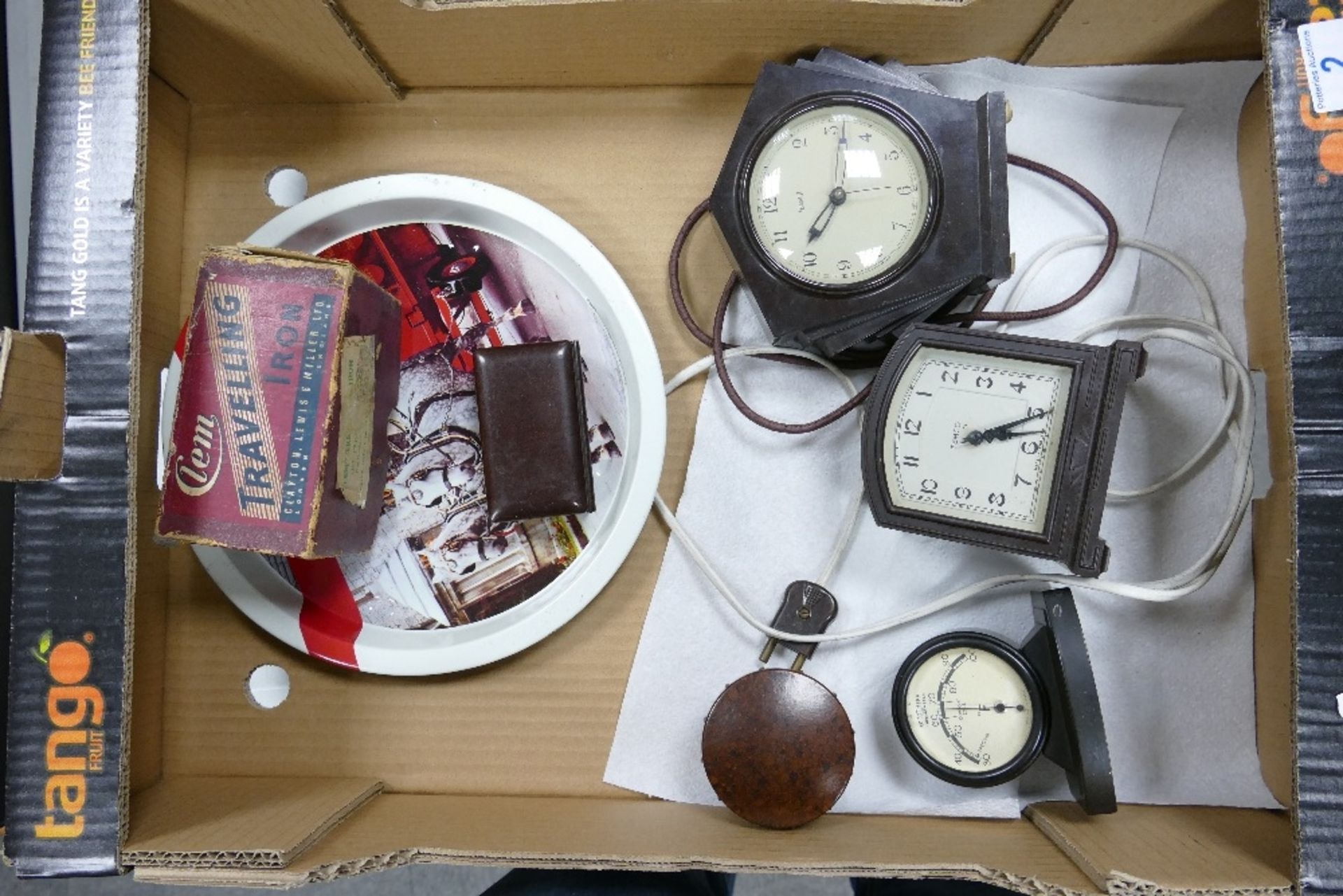 A collection of vintage Bakelite items including clocks, Thgermometer, Gilette Razor Box together