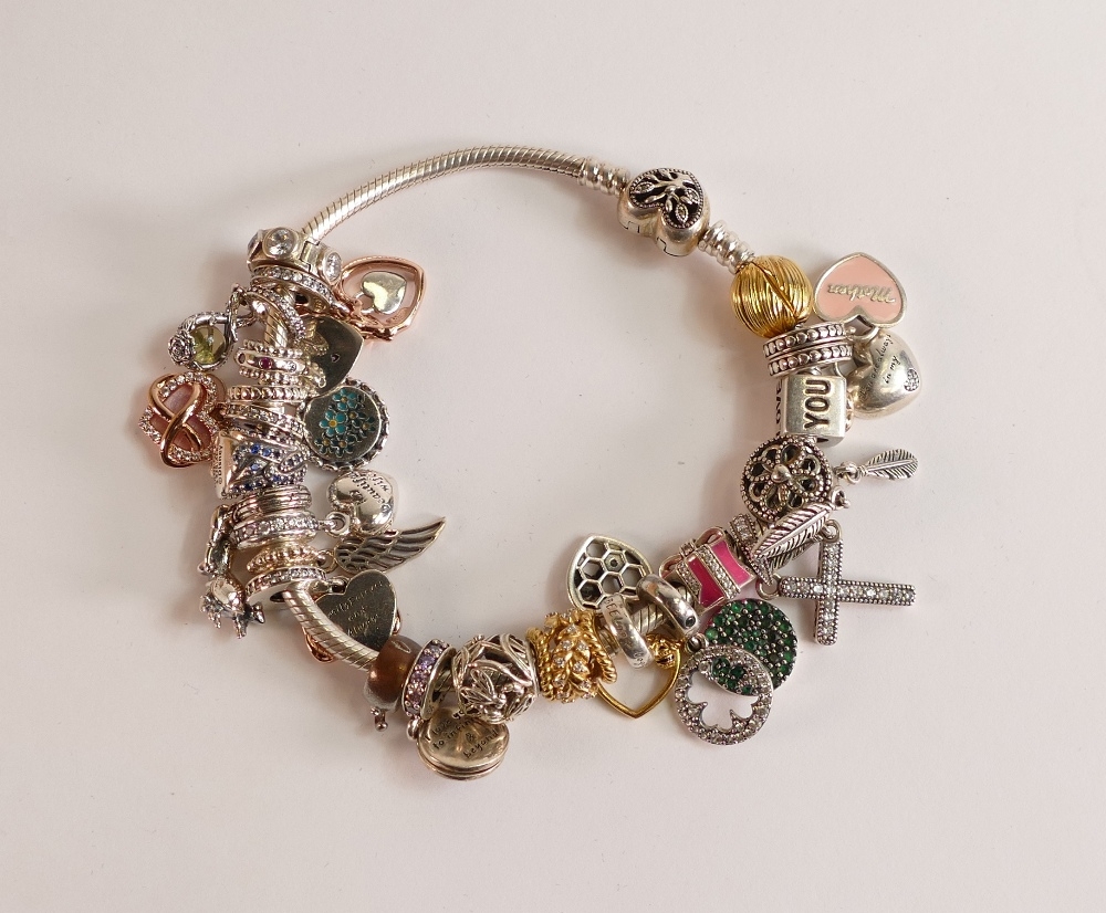 Pandora bracelet with over 20 charms, boxed.