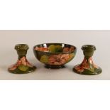 Moorcroft Hibiscus on green bowl and matching candlesticks. Diameter of bowl 16cm