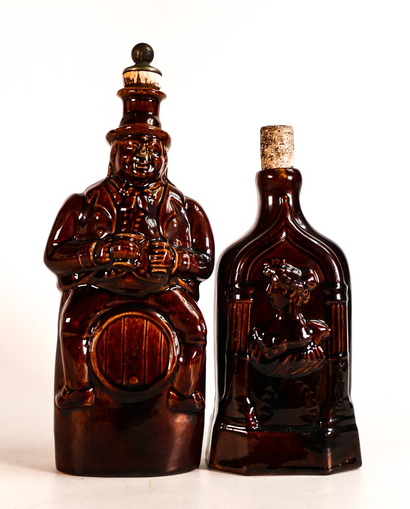 Rockingham style Treacle glazed spirit flasks, one with raised Queen Victoria & Duchess of Kent