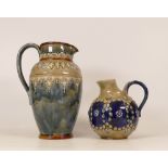 Royal Doulton Lambeth stoneware ewer and smaller version floral decorated . Height 21cm (2)