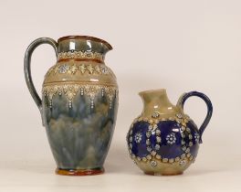 Royal Doulton Lambeth stoneware ewer and smaller version floral decorated . Height 21cm (2)