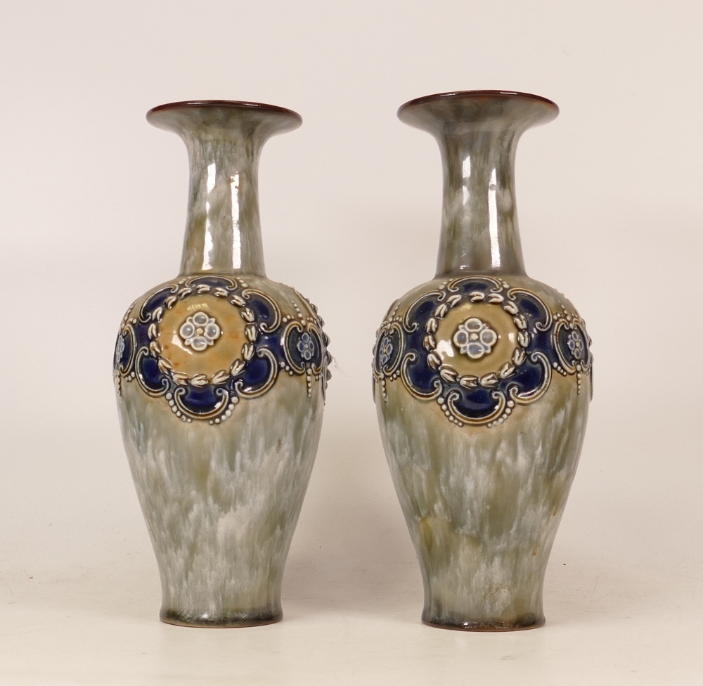 A pair of Royal Doulton Lambeth stoneware vases floral decorated . Height 22.5cm (2)