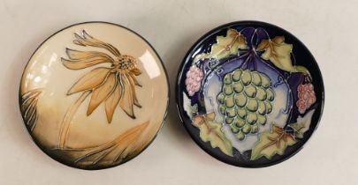 Two Moorcroft pin dishes to include Cornflower (silver lined) and Christmas grapes. Boxed