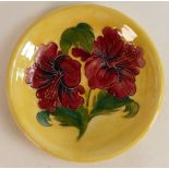 Moorcroft red Hibiscus on yellow plate . Diameter 21.5 cm