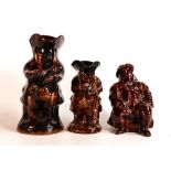 Three Rockingham style treacle glazed character jugs, tallest 23.5cm - two at fault. (3)