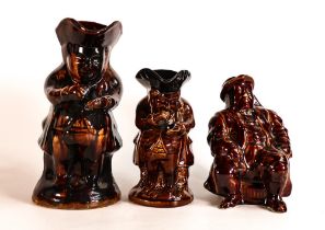 Three Rockingham style treacle glazed character jugs, tallest 23.5cm - two at fault. (3)