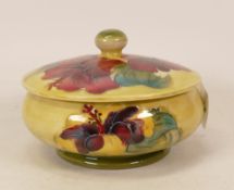 Moorcroft Hibiscus lidded pot on faded yellow/green ground, height 10cm