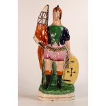 Staffordshire military themed figure bearing an orange flag with sword and shield in hand, re-