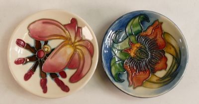 Two Moorcroft pin dishes to include Frangipani and Anna Lily. Boxed