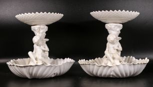 Two late 19th century Copeland porcelain Putti form comports, height of tallest 23cm (2)