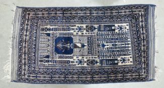 An Eastern Prayer Rug with Religious Architectural Patterns. Wear and Fraying Noted. Length: 170cm
