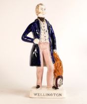 Mid-Victorian Staffordshire figure depicting Arthur Wellesley, The Duke of Wellington. Firing