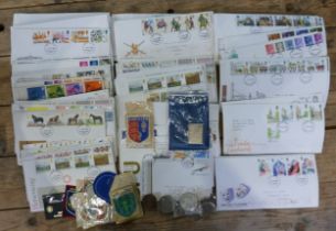 A collection of many dozens of UK 1960's - 80's First Day covers, a few coins & badges.