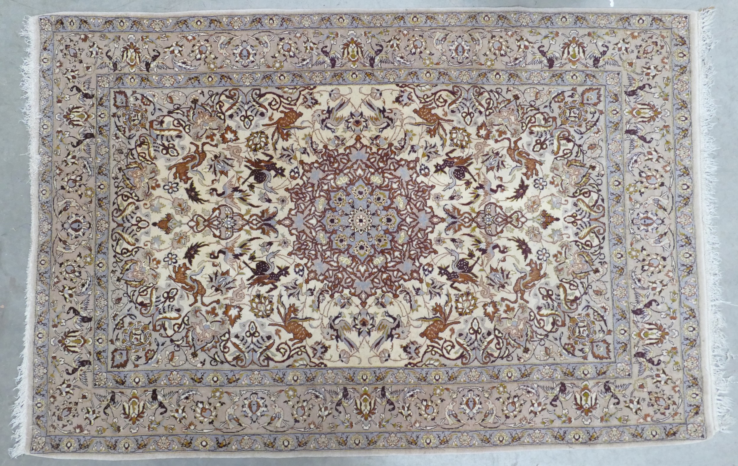 A Persian Style Floor Rug with Animal Patterns. Length: 170cm Width: 110cm