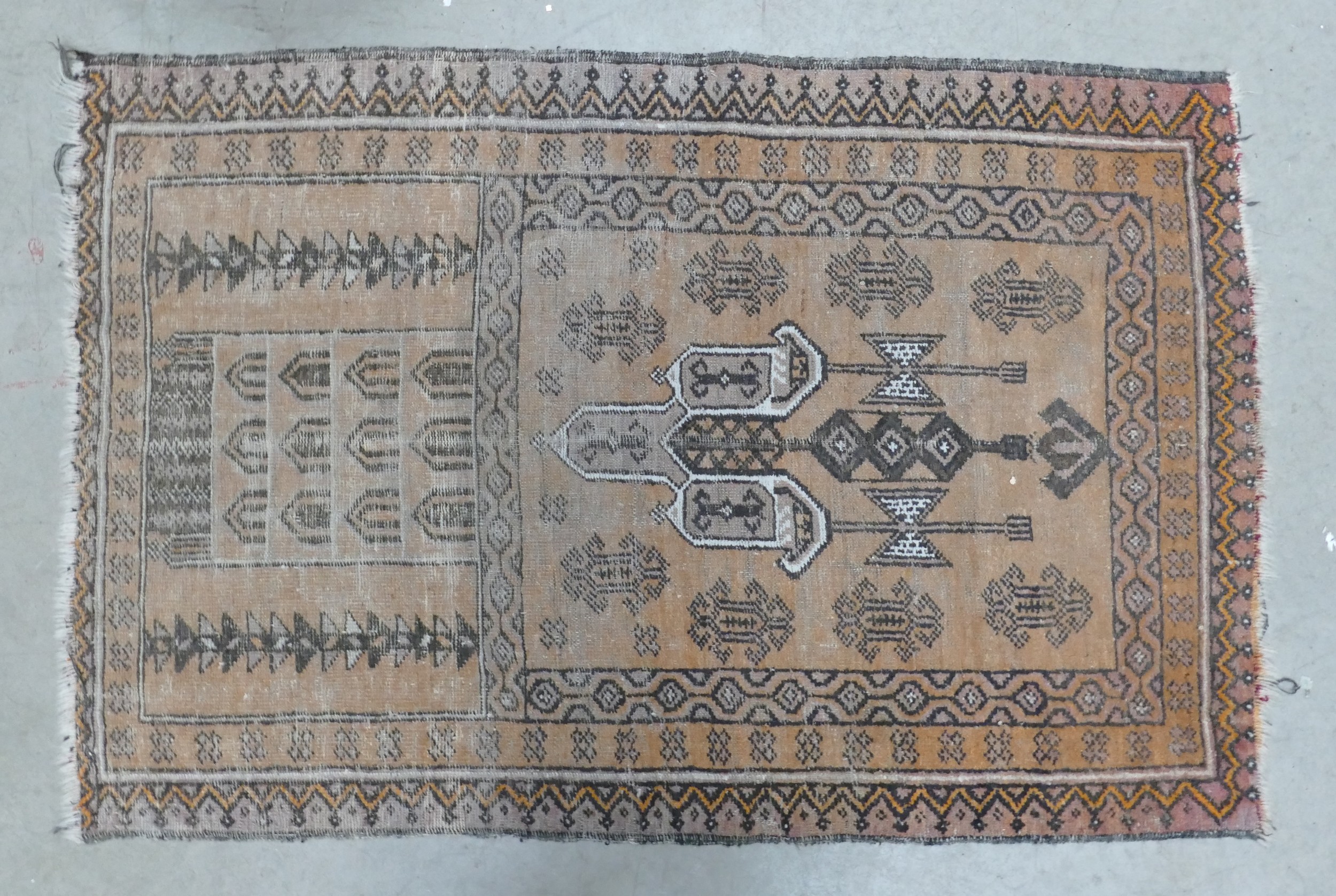 A Distressed Afghan Style Prayer Rug. Wear and fraying noted. Length: 138cm Width: 90cm