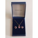9ct gold ruby pendant, necklace and earrings, 3g. (4)