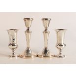 Pair of silver candlestick and a pair of silver vases, both UK hallmarked and with loaded bases.