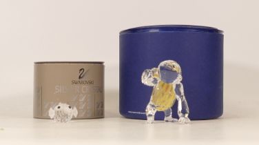 Two Boxed Swarovski Animals to include Pufferfish and Chimpanzee, boxed
