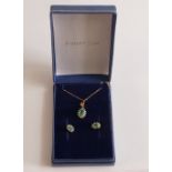 9ct gold Emerald set pendant, chain and matching earrings,2.3g. (4)