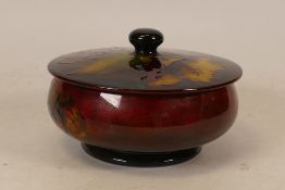 Moorcroft Hibiscus flambe lidded pot . Diameter 11cm