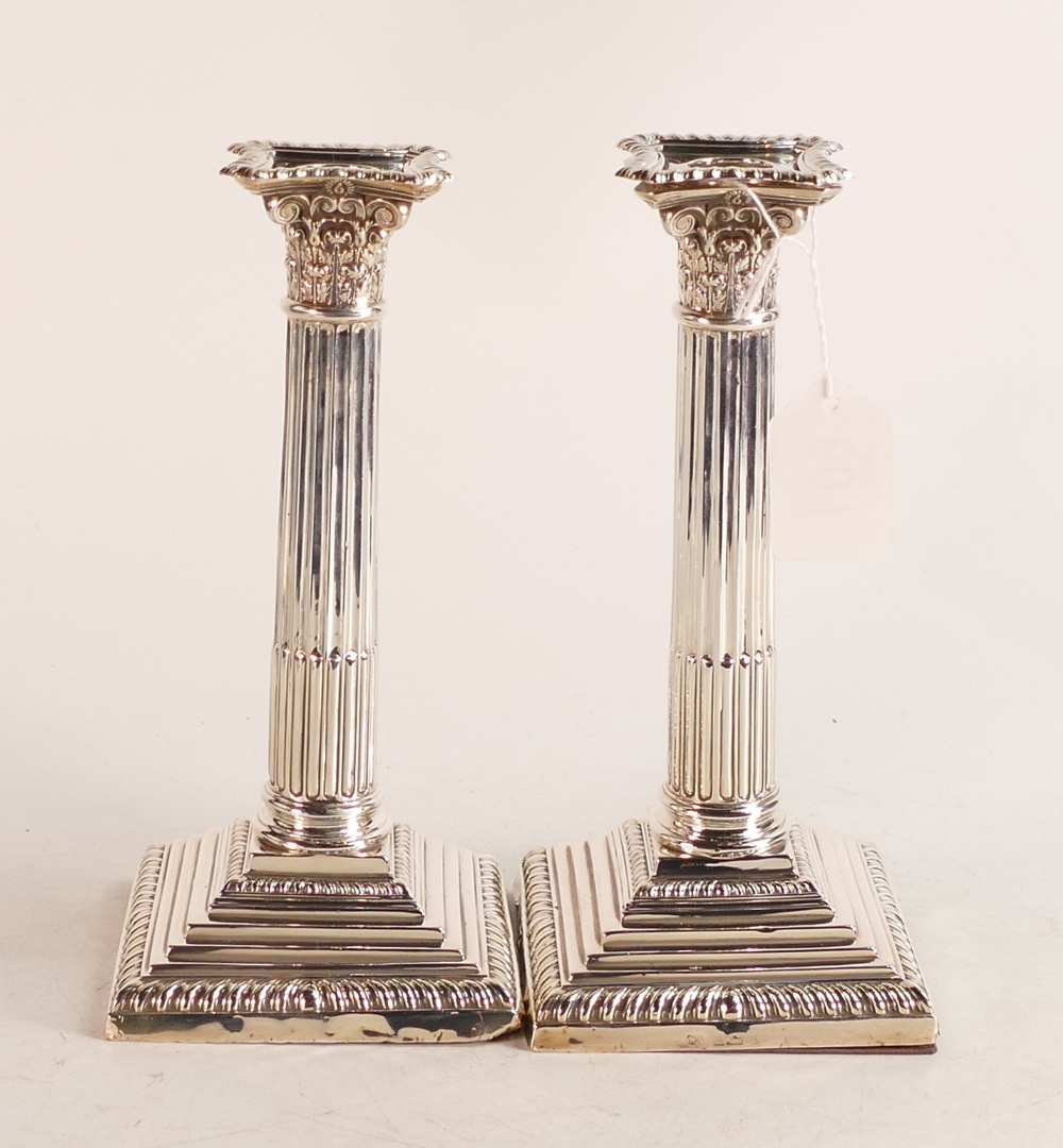 Pair of large hallmarked silver Corinthian column candlesticks with loaded bases. Hallmarks for