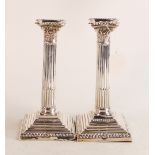 Pair of large hallmarked silver Corinthian column candlesticks with loaded bases. Hallmarks for