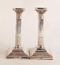 Pair of large hallmarked silver Corinthian column candlesticks with loaded bases. Hallmarks for