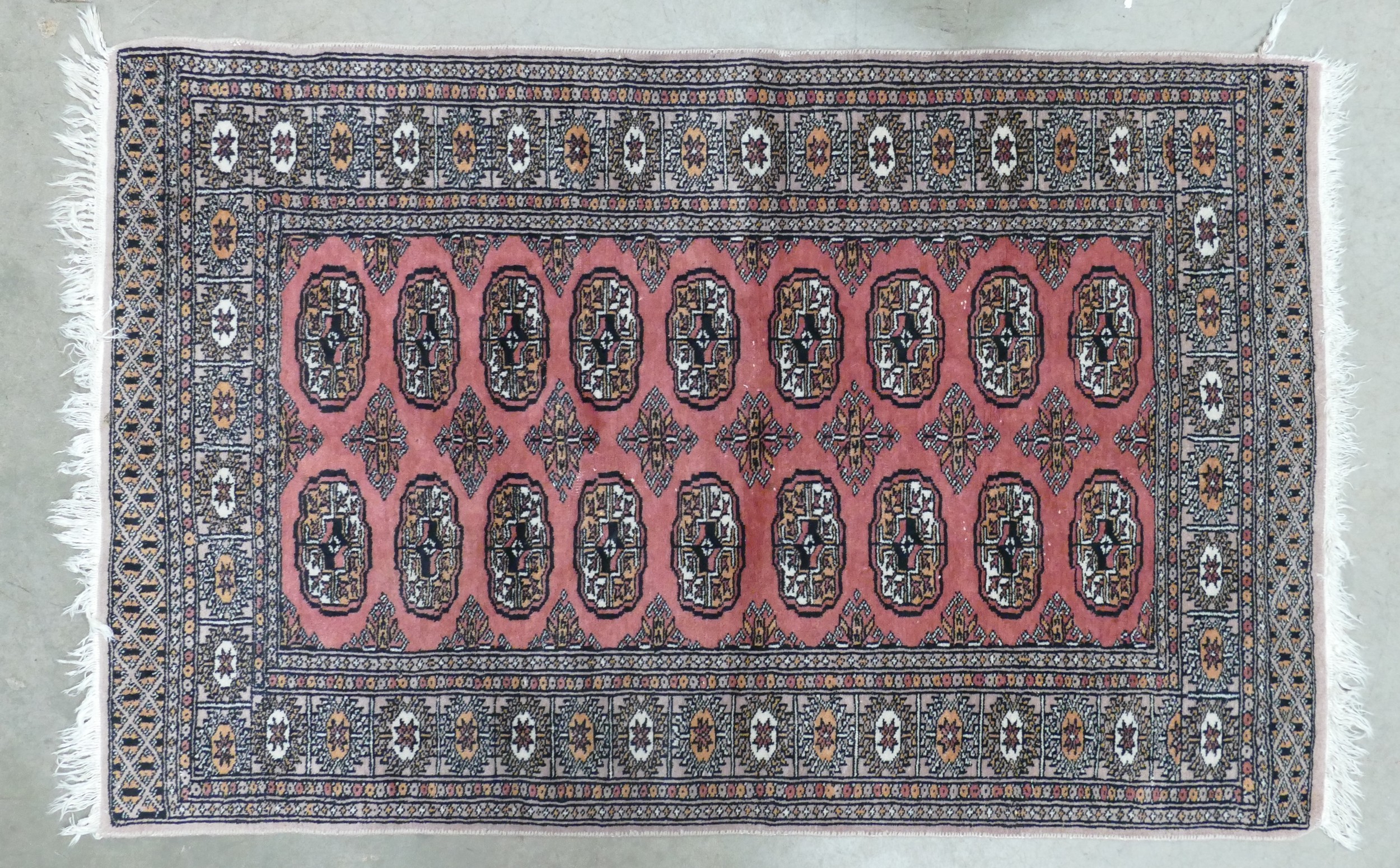 A Red Uzbek Bokhara Style Rug. Wear and Fraying Noted. Length: 162cm Width...