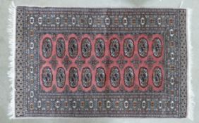 A Red Uzbek Bokhara Style Rug. Wear and Fraying Noted. Length: 162cm Width: 97cm