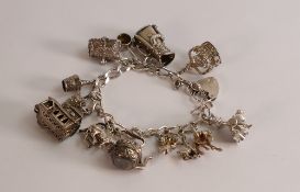 Silver charm bracelet, 67.8g.
