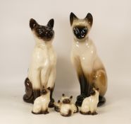 Beswick Siamese seated cat 2139, two smaller seated Siamese cats 1837, kittens and a similar