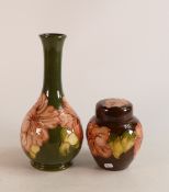 Moorcroft Hibiscus on green bud vase together with small ginger jar on brown. Height of vase 21.5cm