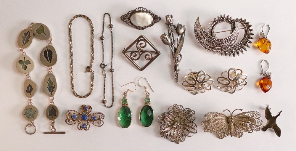 Collection of sterling silver jewellery including brooches, earrings, bracelets. All appears to be