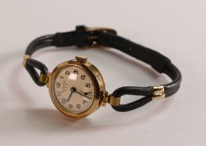 Ladies Bernex 9ct gold cocktail watch with leather strap.
