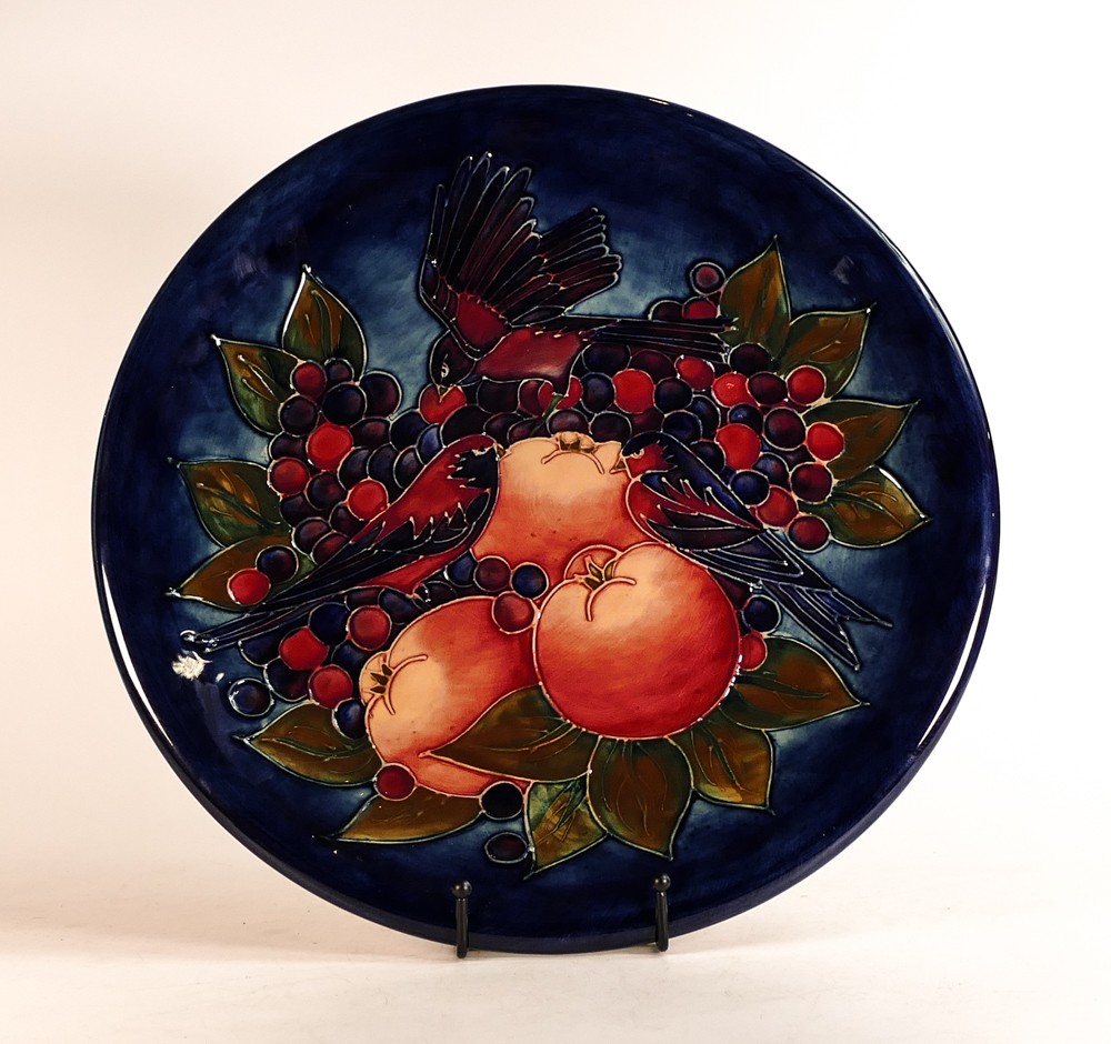 Moorcroft large charger decorated in the Finch and Berries design on dark blue ground, C1990, d. - Image 2 of 3