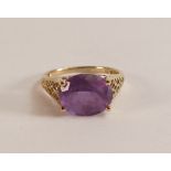 9ct gold ladies dress ring set with oval purple stone, size K, 2.1g.