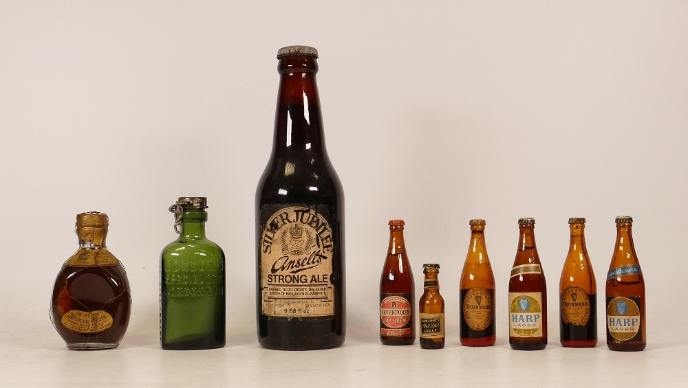 A collection of vintage miniature bottles of Guinness , Harp lager , dimple together with a bottle