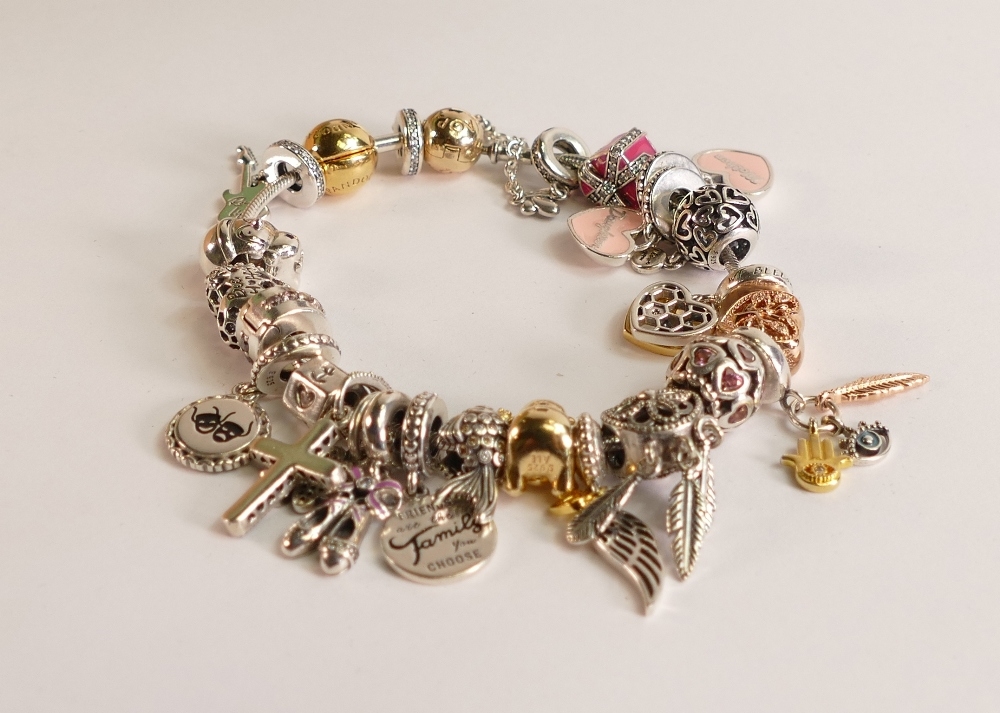 Pandora bracelet with over 20 charms, boxed.