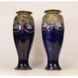 A pair of Royal Doulton Lambeth stoneware vases classical floral decorated . Height 29cm (2)