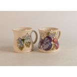 Two Moorcroft mugs to include Blue Clematis and M.C.C 1993 (2)