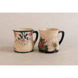 Two Moorcroft Mugs to include mug of the year 2004 and mug decorated in wild flowers on blue and
