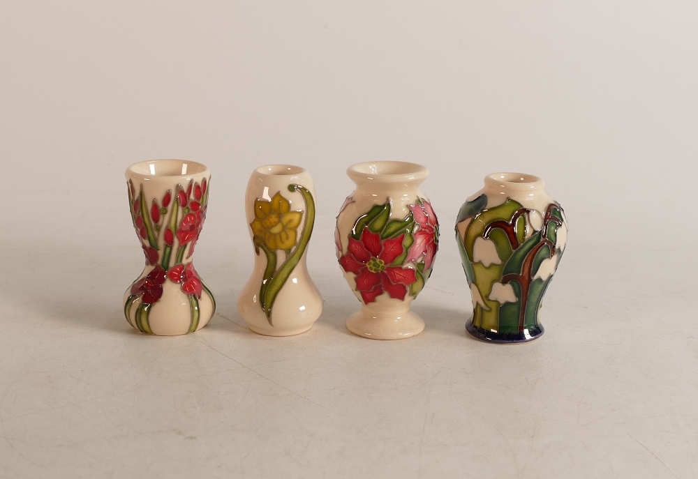 Four Moorcroft flower of the month miniature vases, snowdrop seconds.