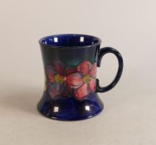 Large Moorcroft mug decorated in the Clematis pattern, height 10cm