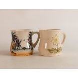 Two Moorcroft mugs to include Caribbean (crazed) and wild daisy (2)