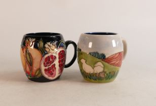 Two Moorcroft Mugs to include Pomegranate and Sheep in the field (slight crazing) (2)