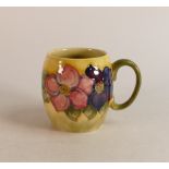 Moorcroft Clematis mug on faded yellow/green Background